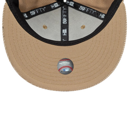 LA Dodgers MLB Heather Tan New Era 59FIFTY Fitted Cap, inside view showing a tan undervisor with a baseball graphic sticker, black interior sweatband, and black and white 59FIFTY taping lining the grey panels for added detail.