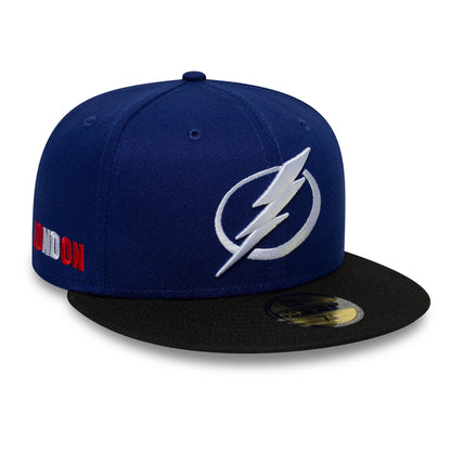 Pictured is this NHL London Game 2026 Tampa Bay Lightning 59FIFTY Fitted cap in dark blue and black. 1