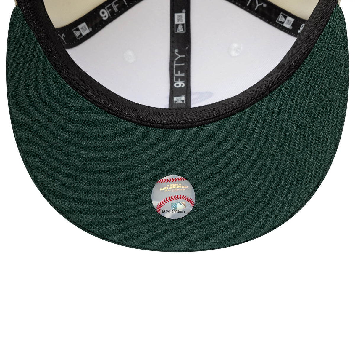 Pictured is this MLB Chicago White Sox 9FIFTY Snapback cap in cream and dark green. 7