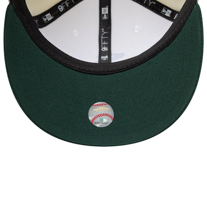 Pictured is this MLB Chicago White Sox 9FIFTY Snapback cap in cream and dark green. 7