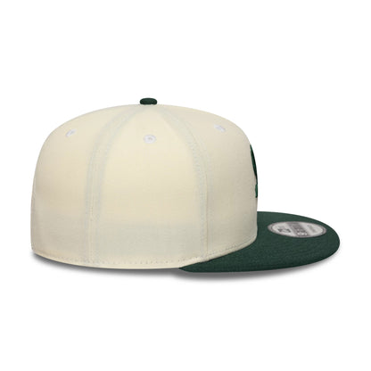 Pictured is this MLB Chicago White Sox 9FIFTY Snapback cap in cream and dark green. 5
