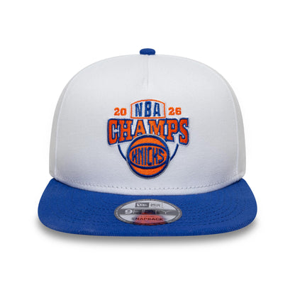 Pictured is this NBA Champs 2025 - 2026 New York Knicks 9FIFTY A-Frame Snapback cap in white and blue. 3