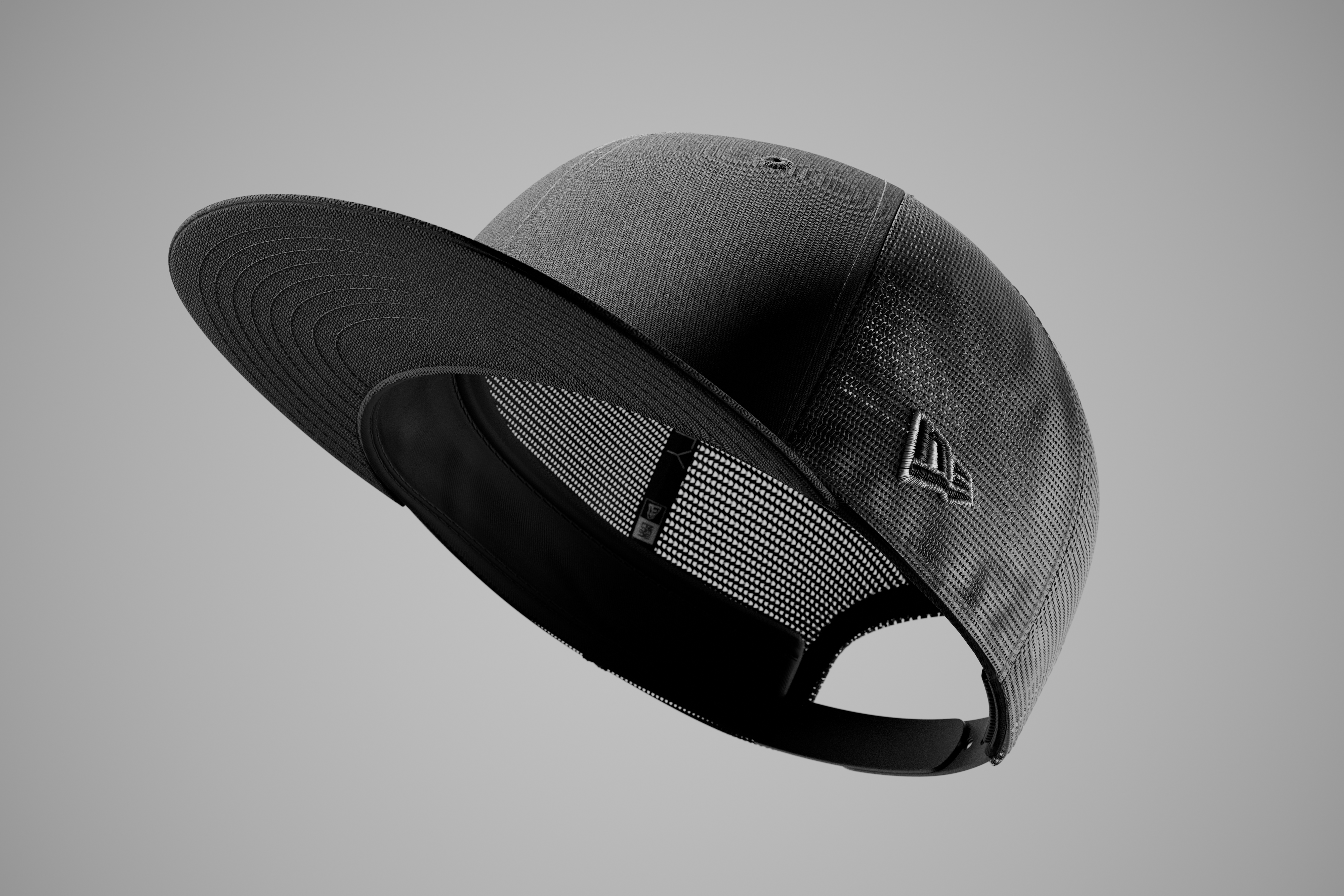 Black new era 9fifty trucker cap on a grey background