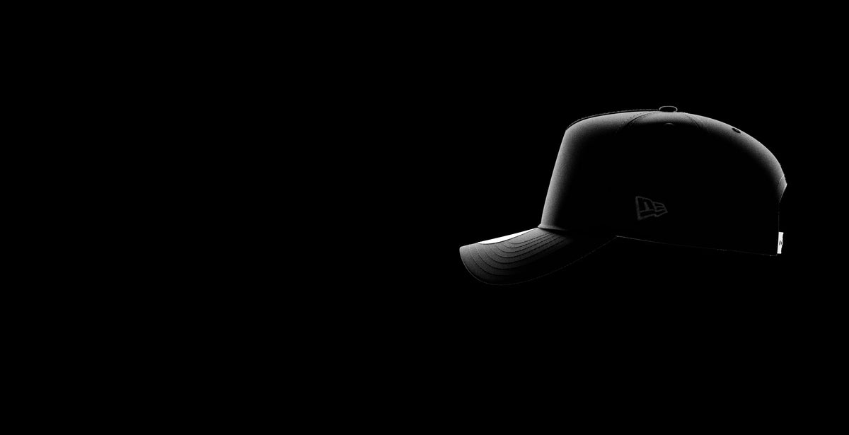 A black baseball cap with a New Era logo on the side.