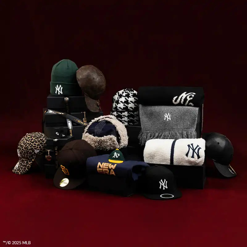 Collection of baseball caps with various logos on a dark background
