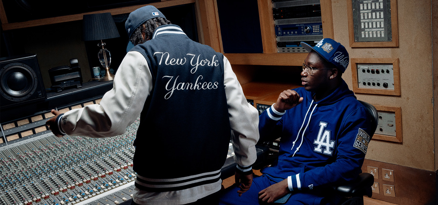 A1 J1 wearing New Era Collection Caps and Jackets in the studio.