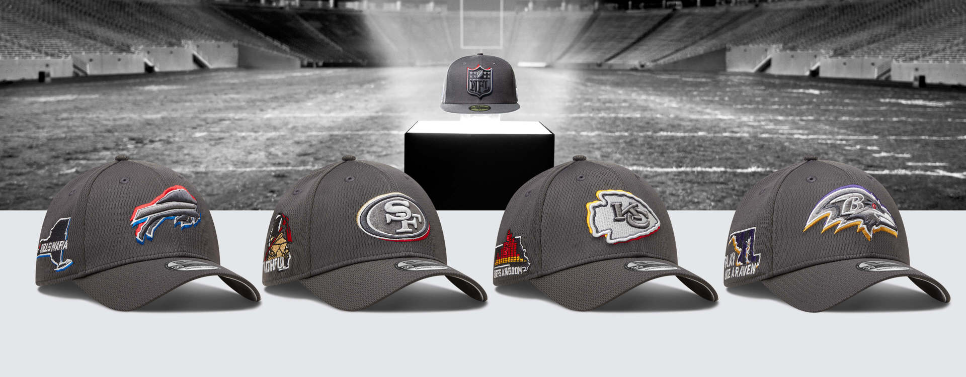 four grey nfl caps showcasing different teams with a football stadium background