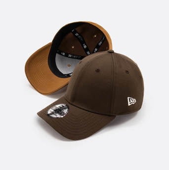 two blank brown 39THIRTY caps, one flipped upside down and one showing new era logo