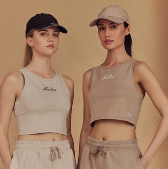 two females wearing new era's essentials collection