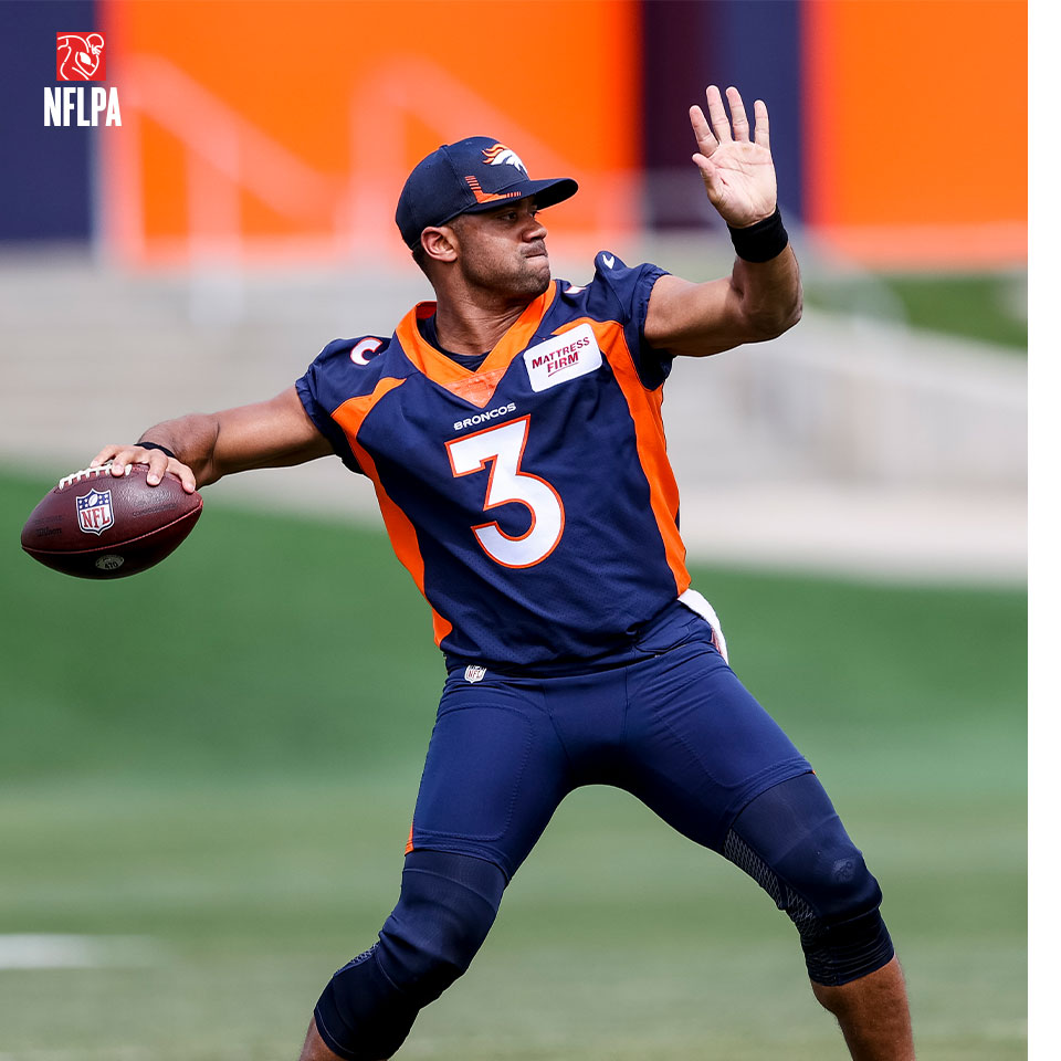 Denver Broncos quarterback, Russell Wilson, throwing american football