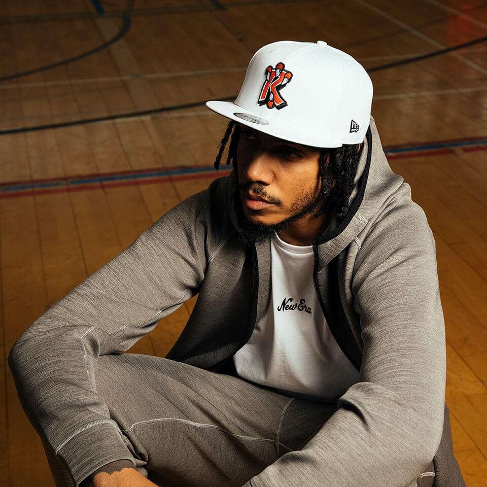 AJ Tracey wearing White 59FIFTY cap