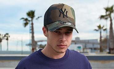 man wearing camo new york yankees trucker cap